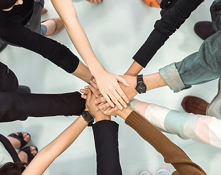 two people walking in front of a large white building with Sheikh Zayed Mosque in the background