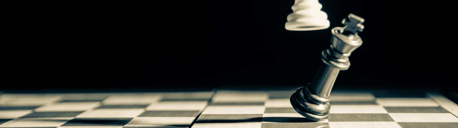 black and white chess board with pieces