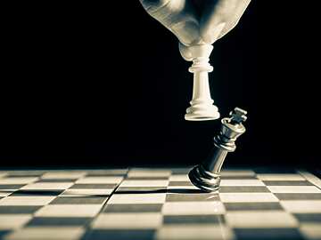 black and white chess board with pieces
